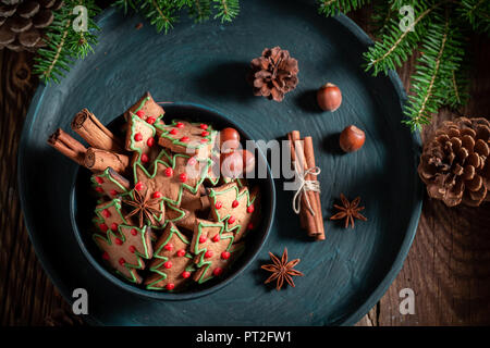 Gingerbread cookies in the shape of Christmas tree on tray Stock Photo
