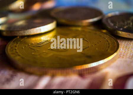 Golden bitcoin coin and euro money Stock Photo