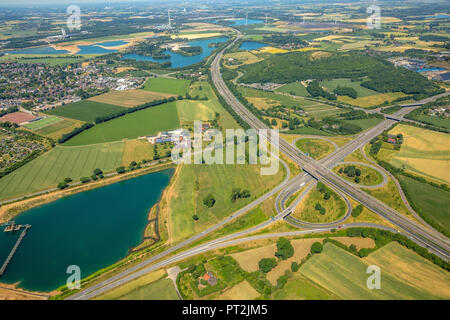 A57 motorway junction and A52 motorway, end of A52, FRIKA Kies GmbH & Co. KG, gravel pit, quarry pond Haarbeckstrasse, Kamp-Lintfort, Ruhr area, North Rhine-Westphalia, Germany Stock Photo