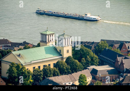 City church St. Mary of the Assumption with cargo ship on the Rhine at Rees, Rees, Lower Rhine, Rhine, North Rhine-Westphalia, Germany Stock Photo