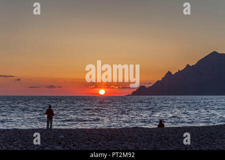 View in atmospheric sunset on the beach of Porto, Corsica, World Heritage Site by UNESCO Stock Photo