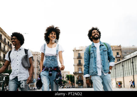 Spain, Barcelona, three friends walking together in the city Stock Photo