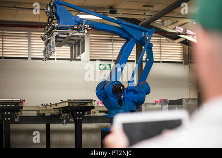 Worker using tablet in factory Stock Photo