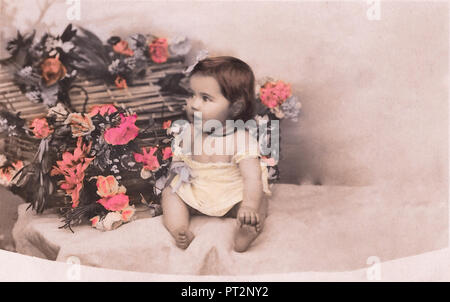 Vintage postcard of cute little baby girl. 1910s. Stock Photo
