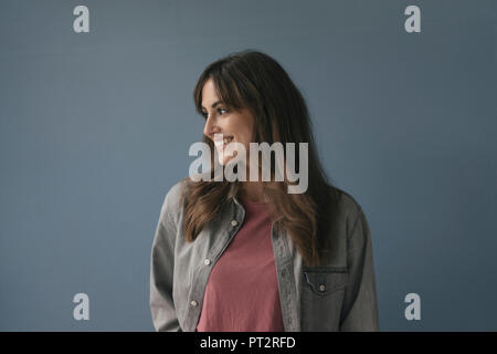 Smiling woman looking away Stock Photo