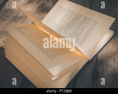 book opened on wood table Stock Photo