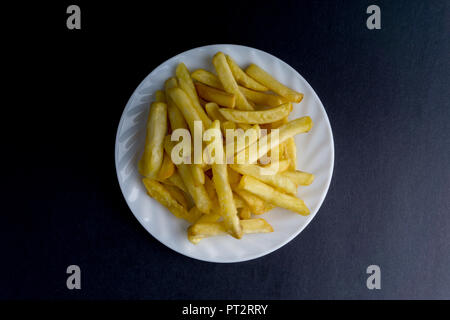 Potato fry or fries on dark background with selective focus and crop fragment Stock Photo
