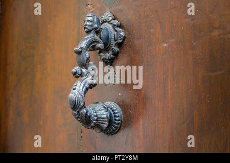 Antique door knocker in Gruissan Stock Photo