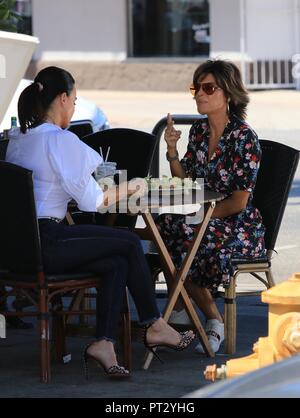Kyle Richards arrives to meet Lisa Rinna in a three wheel Vanderhall ...