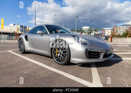 HAMBURG / GERMANY - SEPTEMBER 28, 2018: Porsche 911 stands on parking lot near the Airport Hamburg Stock Photo