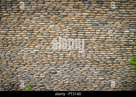 Beautiful River Pebble Wall Background. Seamless pebble stone floor and wall pattern arranged for texture wallpaper. Stock Photo