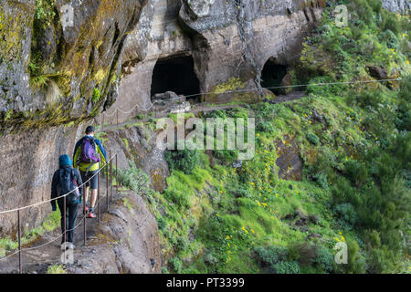 People walking on the trail from Pico Ruivo to Pico do Areeiro, Santana, Madeira region, Portugal, Stock Photo