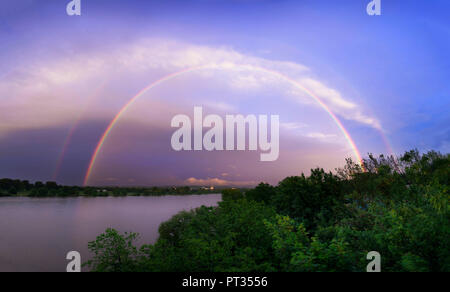 Double Rainbow across River Rhine, taken from bridge in Bonn, Germany Stock Photo