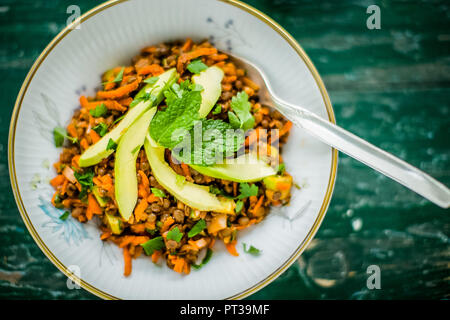 Lentil and carrot salad with avocado and mint Stock Photo