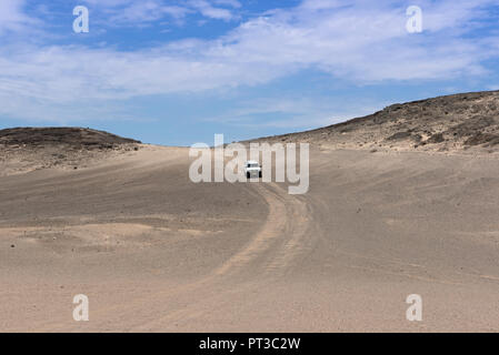 car on a sand road in the mondlandschaft east of swakopmund, namibia. Stock Photo