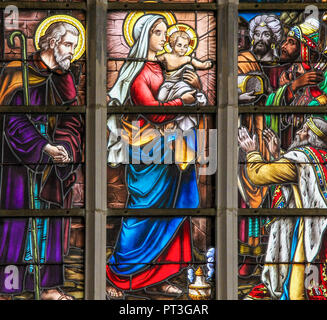 Stained Glass depicting the Three Kings visiting the infant Jesus in the Church of Haacht, Belgium. Stock Photo