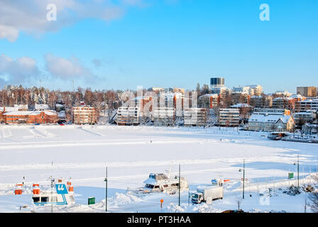 LAPPEENRANTA, FINLAND - FEBRUARY 18, 2010: Winter landscape with boats in harbor  on Saimaa Lake. View from Linnoitus Fortress. Stock Photo