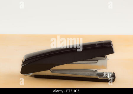 new stapler for stapling papers on a table Stock Photo