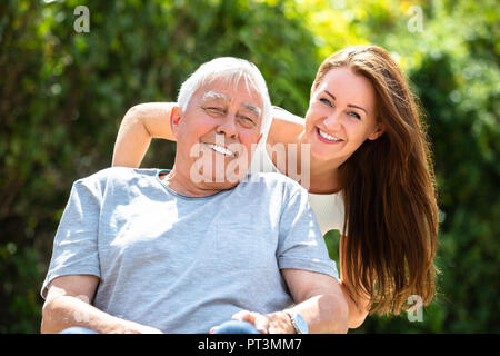 Portrait Of Happy Father And Daughter At Outdoors Stock Photo