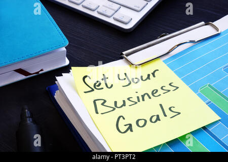 Set your business goals. Stack of financial documents. Stock Photo