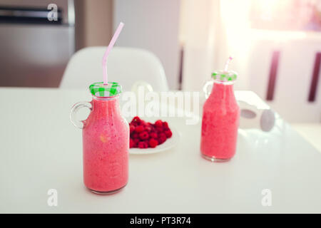 Premium Photo  Glass bottle of juice on a fridge shelf