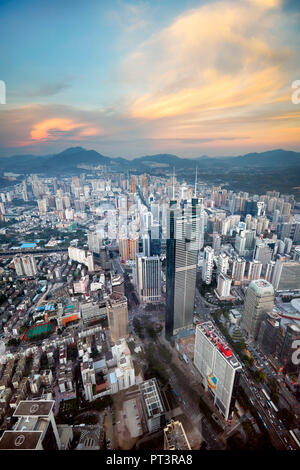 Aerial city view from the top of KK100 (Kingkey 100) skyscraper at sunset. Luohu District, Shenzhen, Guangdong Province, China. Stock Photo