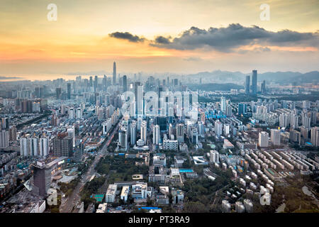 Aerial city view from the top of KK100 (Kingkey 100) skyscraper at sunset. Luohu District, Shenzhen, Guangdong Province, China. Stock Photo