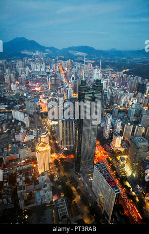 Aerial city view from the top of KK100 (Kingkey 100) skyscraper at dusk. Luohu District, Shenzhen, Guangdong Province, China. Stock Photo