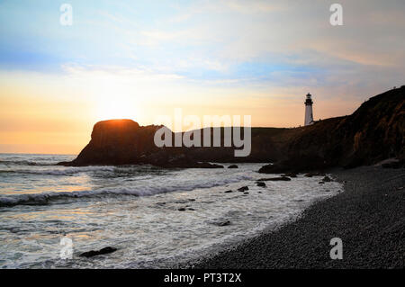 Along the Oregon Coast: Yaquina Head Lighthouse at Sunset Stock Photo