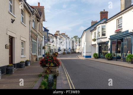 Looking up Causeway, the high street through Beer, Devon, England, UK Stock Photo