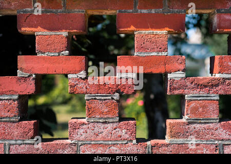 Details of a red brick wall with pattern on a sunny day in summer