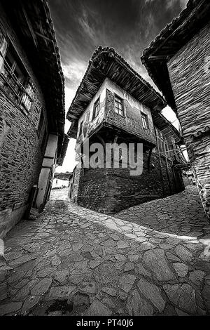 Birgi, hidden in a green geography on the cool slopes of Bozdağlar, can be seen from centuries-old plane trees and walnut trees with high stone walls, Stock Photo