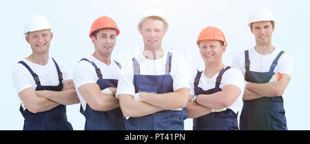 Group of builders in overalls isolated on white background Stock Photo