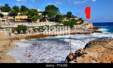 Red flag in Cala Molins cove, Cala San Vicente, Mallorca, Balearic Islands, Spain Stock Photo