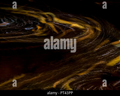 Europe, Germany, Saxony-Anhalt, Harz National Park, autumn leaves in a vortex at Ilse, Ilsetal, Ilsenburg Stock Photo