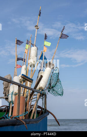 Fishing nets and ropes on a fishing boat. Fishing boats and fishing nets in a sea port. Autumn season Stock Photo