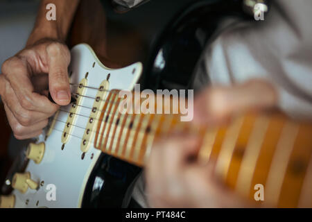 Guitarist playing electric guitar Stock Photo