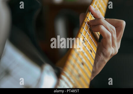 Guitarist playing electric guitar Stock Photo