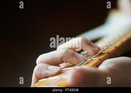 Guitarist playing electric guitar Stock Photo