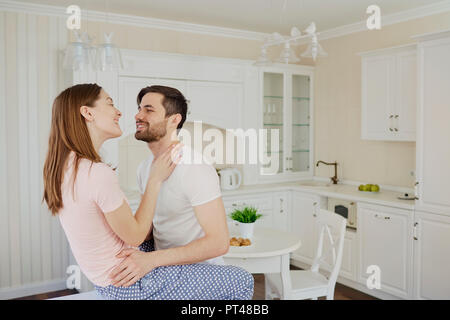 Young couple having fun in the kitchen. Stock Photo