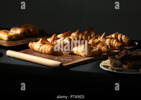 A selection of pastries and croissants pictured on a table for a business brunch in West Sussex, UK. Stock Photo