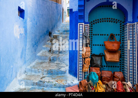Leather bags sale on the street in Chefchaouen in Morocco Stock Photo