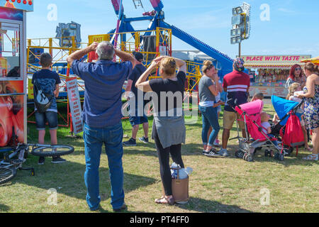 People at the mobile fairground on Margate seafront, Kent, England, UK. Stock Photo