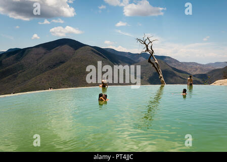 People swimming in a mineral spring pool at Hierve el Agua in Oaxaca, Mexico Stock Photo