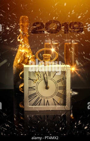 2019 New Year concept with clock and elegant flute and bottle of champagne Stock Photo