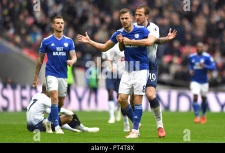 Cardiff City's Joe Ralls is held back by Tottenham Hotspur's Harry Kane after a foul on Lucas Moura, resulting in a red card, during the Premier League match at Wembley Stadium, London. Stock Photo