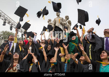 Dhaka, Bangladesh. 6th Oct 2018.  A group of graduates expressing their delight in front of the sculpture Raju at TSC area, on the 51th convocation of the students of Dhaka University in Dhaka , Bangladesh on October 06, 2018.  The University of Dhaka or simply DU, is the oldest university in modern Bangladesh. Established during the British Raj in 1921, it gained a reputation as the 'Oxford of the East' during its early years and has been a significant contributor to the modern history of Bangladesh. Credit: zakir hossain chowdhury zakir/Alamy Live News Stock Photo