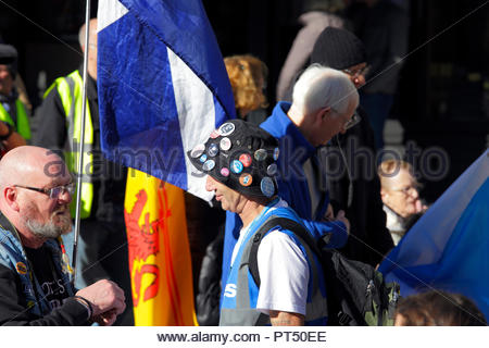 Edinburgh, United Kingdom. 6th October, 2018. Participants in the All Under One Banner (AUOB) march For Independence. All Under One Banner (AUOB) march For Independence, marching down the Royal Mile to the Scottish parliament for a rally in Holyrood Park. AUOB are a Pro-Independence organisation whose core aim is to march at regular intervals until Scotland is Free. They will host public processions in support of Scotland regaining Independence.    Credit: Craig Brown/Alamy Live News. Stock Photo