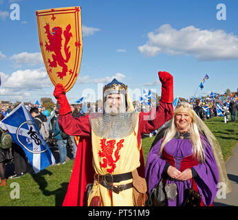 Edinburgh, Scotland, UK. 6th October 2018. 'All Under One Banner March' went ahead with tens of thousands of Scottish supporters waving flags and banners despite a threat of a ban to march into Holyrood Park.  Many had a picnic. The march began at Johnstone Terrace down the Royal Mile and the rally was held in  Holyrood Park. One of the speakers was Tommy Sheridan Socialist Party. Motorcyclists for Independence were applauded through the park by the crowds. Stock Photo