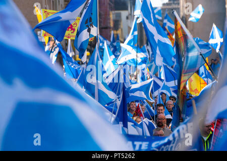 Edinburgh, Scotland, United Kingdom, 7th October 2018. All Under One Banner (AUOB) Scottish March and Rally for Independence. Pro- Scottish independence  supporters walking from Edinburgh Castle to the Scottish Parliament at Holyrood. AOUB is a pro-independence organisation. Credit: Iain Masterton/Alamy Live News Stock Photo